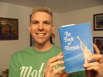 Timothy McGaffin II holding the Book of Mormon