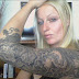 BLACK TATTOOS WITH FLOWERS ON ARM 