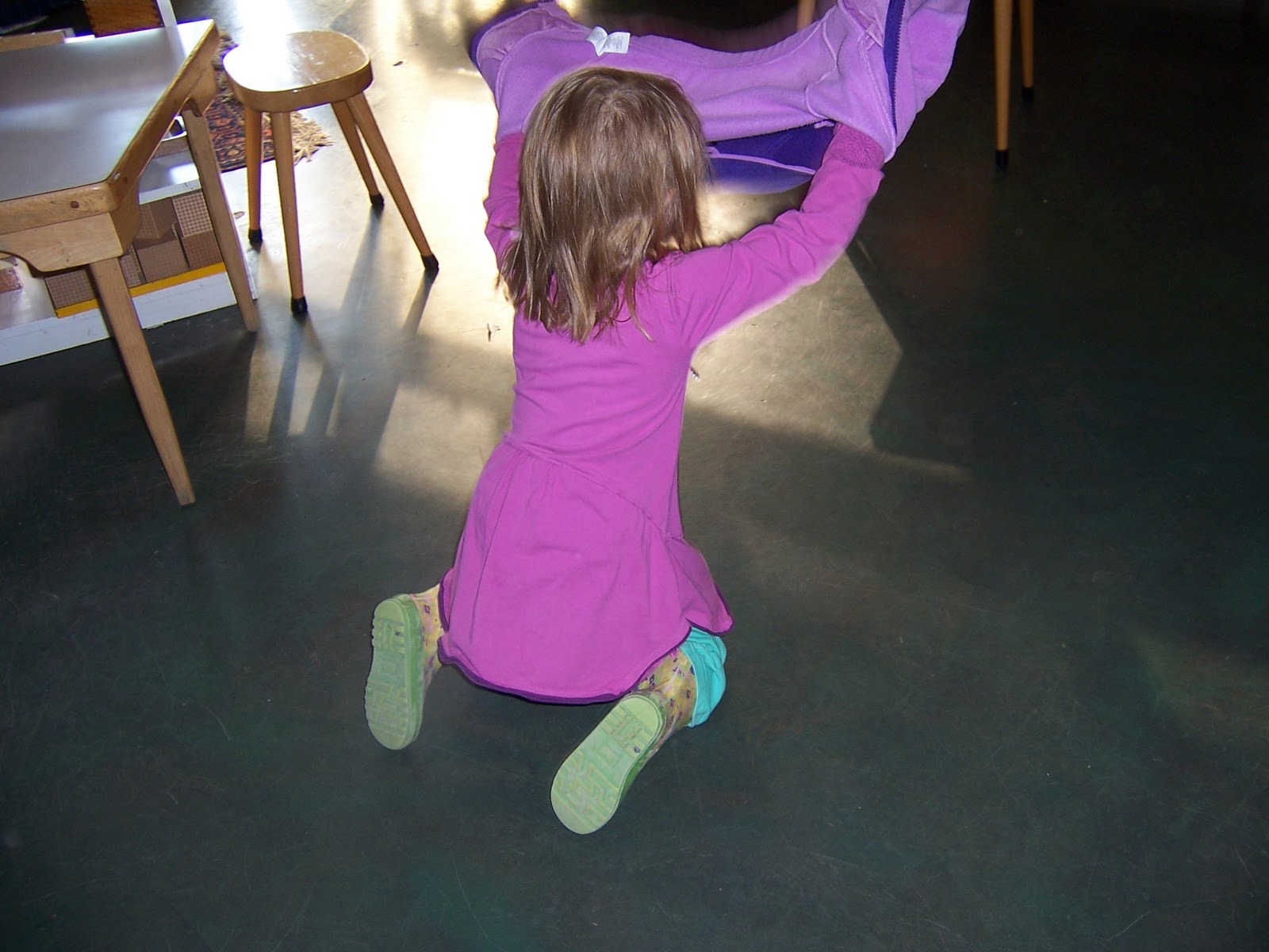 The Montessori Child at Home Putting on a coat...the Montessori way?