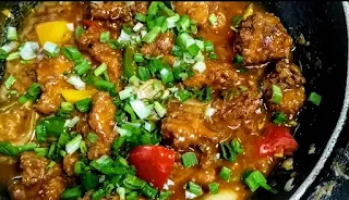 Schezwan chicken gravy topped with spring onions for triple rice recipe