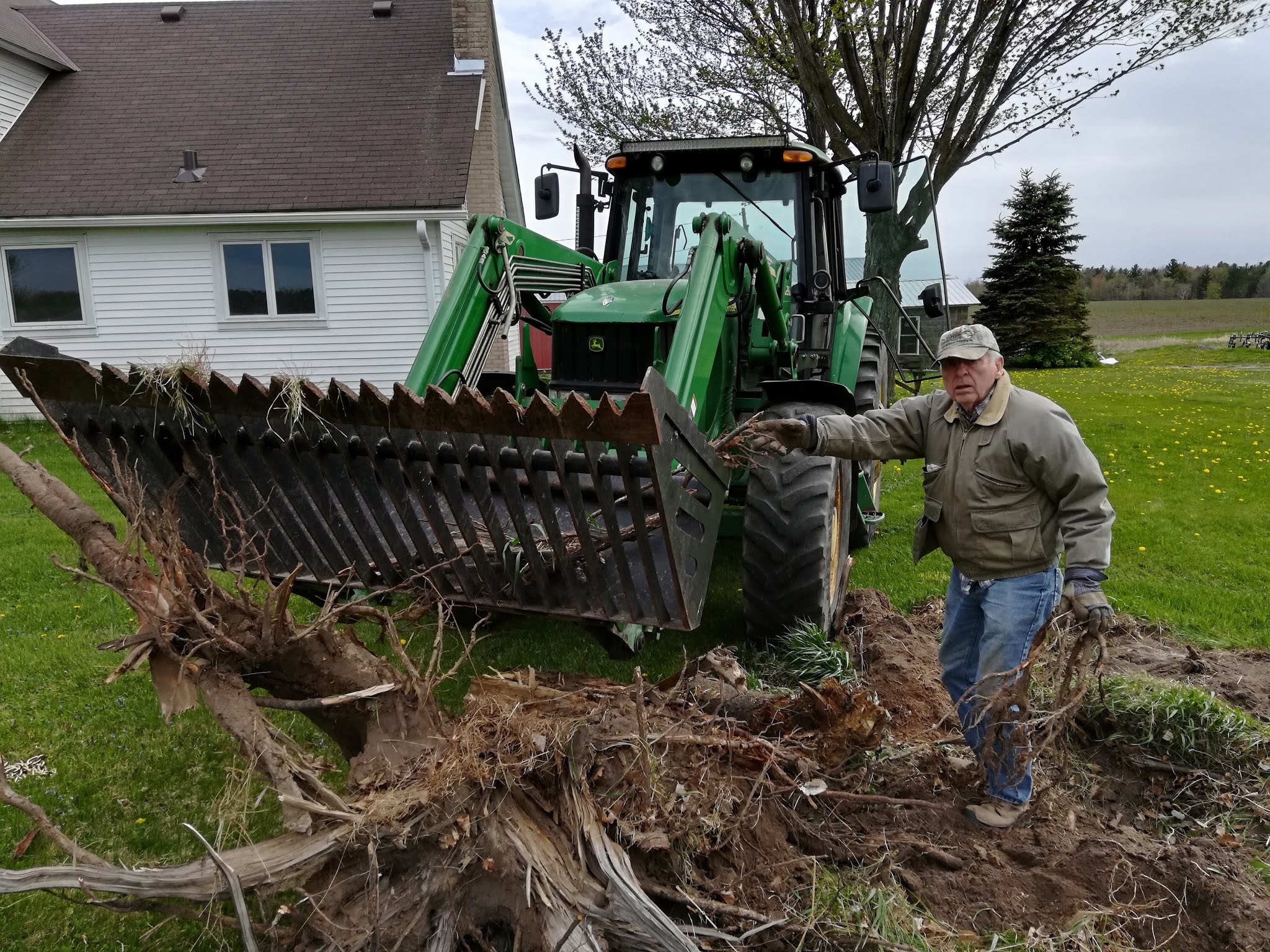 Grass Creek Farm Digging Up a Tree Stump