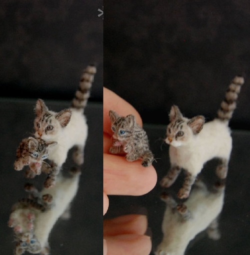 03-Cat-carrying-Kitten-ReveMiniatures-Miniature-Animal-Sculptures-that-fit-on-your-Hand-www-designstack-co