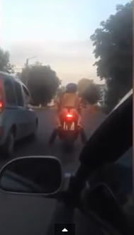 5 Woman is filmed riding on a bike dressed in just her panties and a pair of trainers