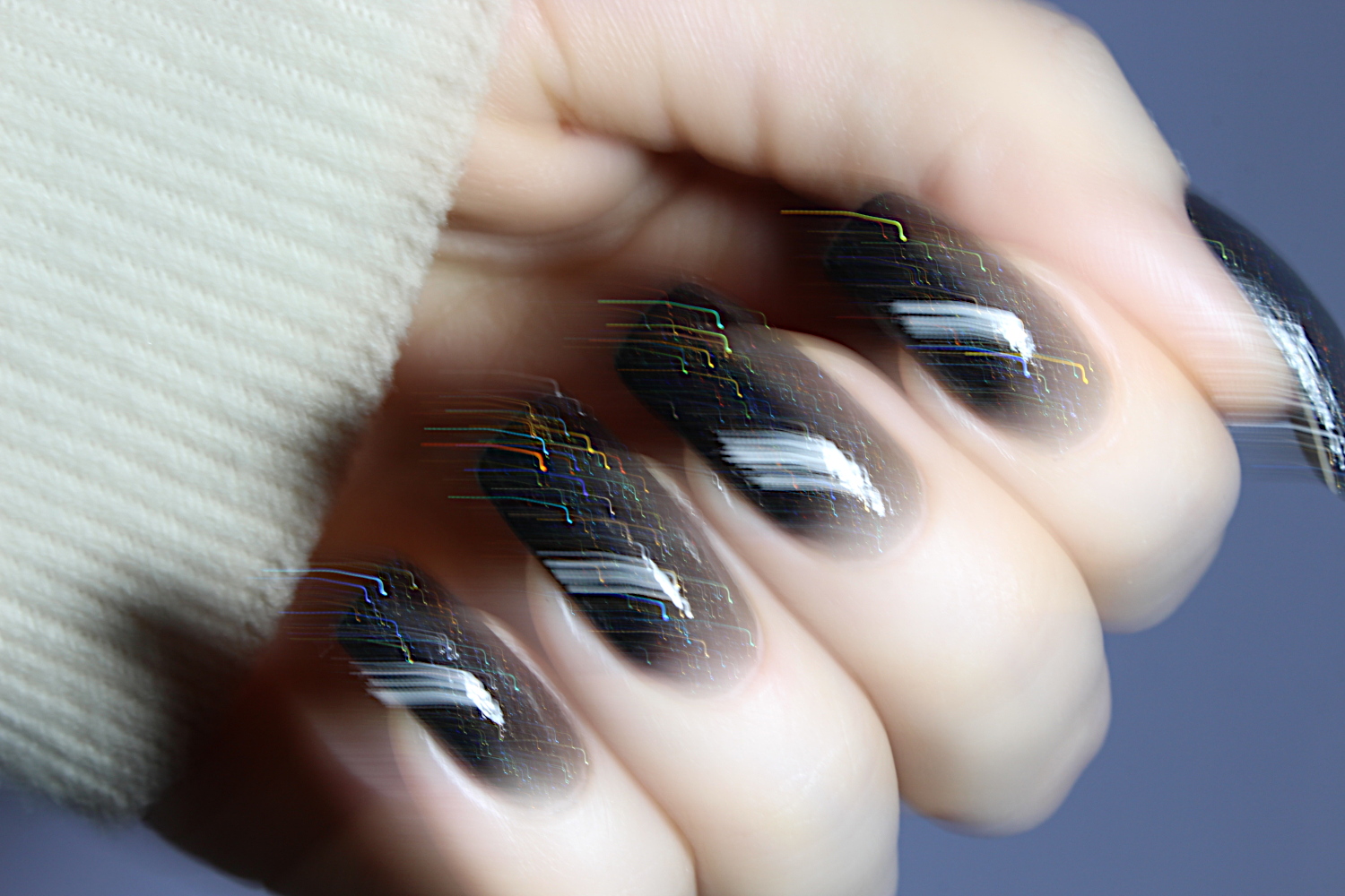 black holographic manicure close up picture