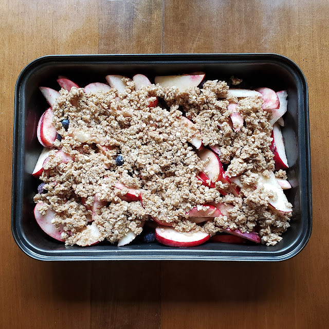 Vegan apple blueberry crumble in a medium-sized baking pan before baking