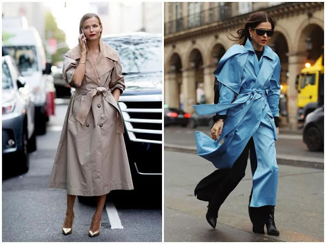 Two women wear a trench coat with double-strap knot.