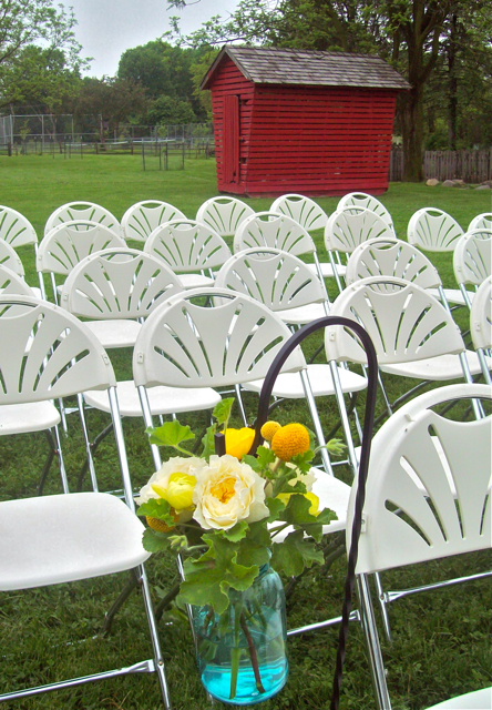 mason jar shepherds hook hanging outdoor decor aisle flowers sweet pea floral design ann arbor, ferndale, detroit, misty farms, boutonniere, craspedia, scabiosa, leucadendron, yellow, green, anthropology, fern, woodsy, barn, nature, once wed, style me pretty, wedding, boutonniere, groom flowers, florist