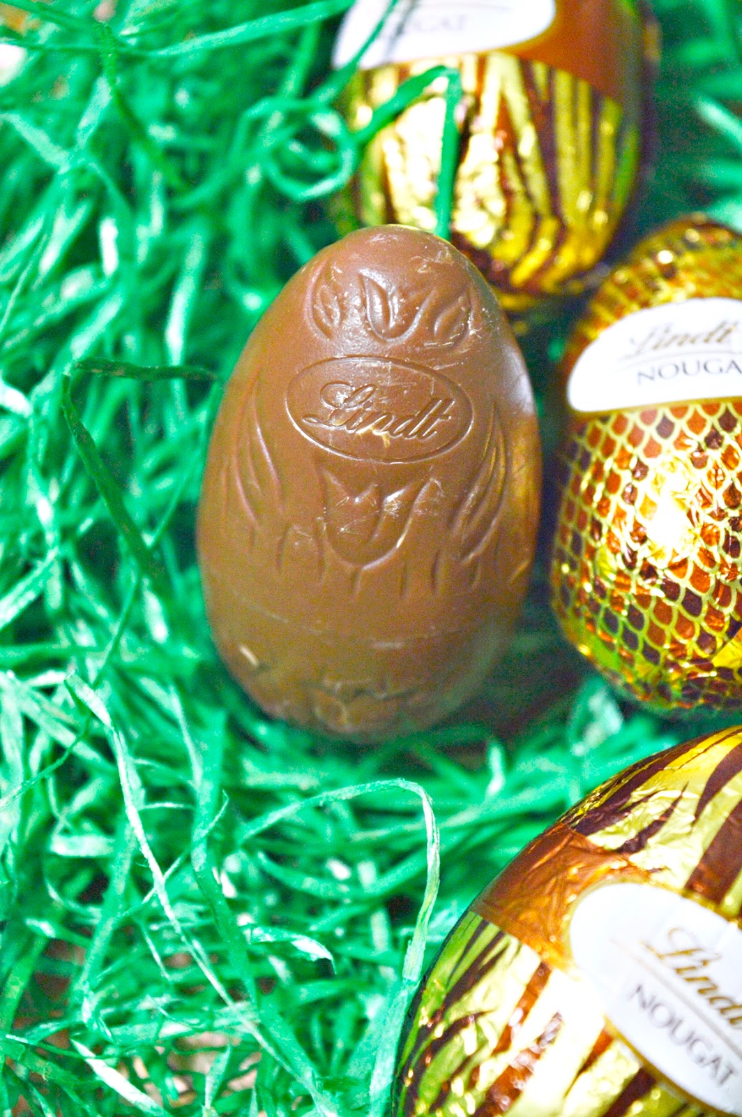 Easter bunny wears Animal Print Metall Egg with nougat eggs