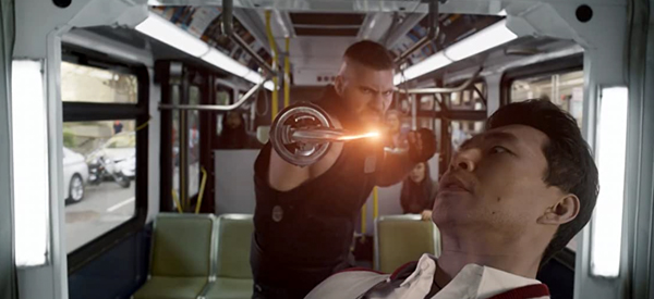 Shaun confronts one of his father's thugs (Razor Fist, played by Florian Munteanu) aboard a bus in SHANG-CHI AND THE LEGEND OF THE TEN RINGS.