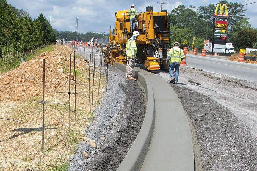 This Versatile Machine Perfectly Poured Concrete To Create Curbs