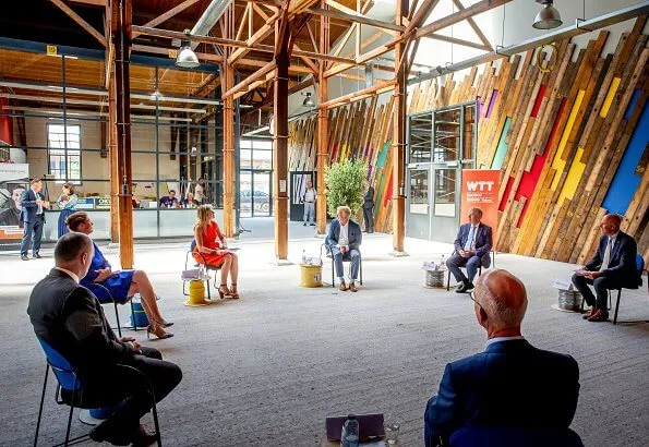 Queen Maxima wore a Natan summer dress in orange. The Queen visited technology facility TechnoHUB in Woerden