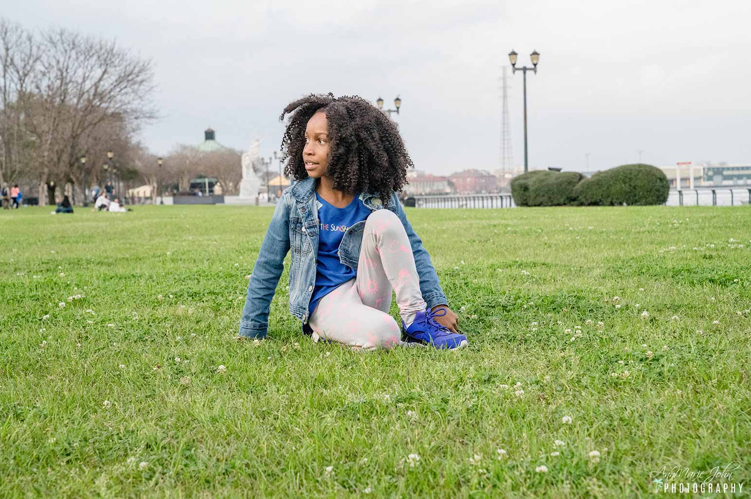 Child Sitting in Grass