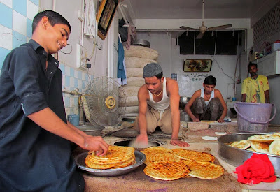 Men preparing special breads locally known as Taftan which are on demand due to Muharramul Haram majalis in Sukkur
