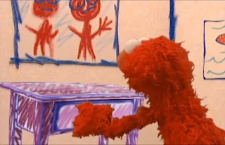 Elmo use his hands to open the drawer. Sesame Street Elmo's World Hands Quiz
