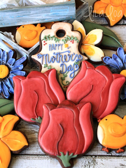 decorated sugar cookies for Mother's Day - tulips, daisies, and daffodils