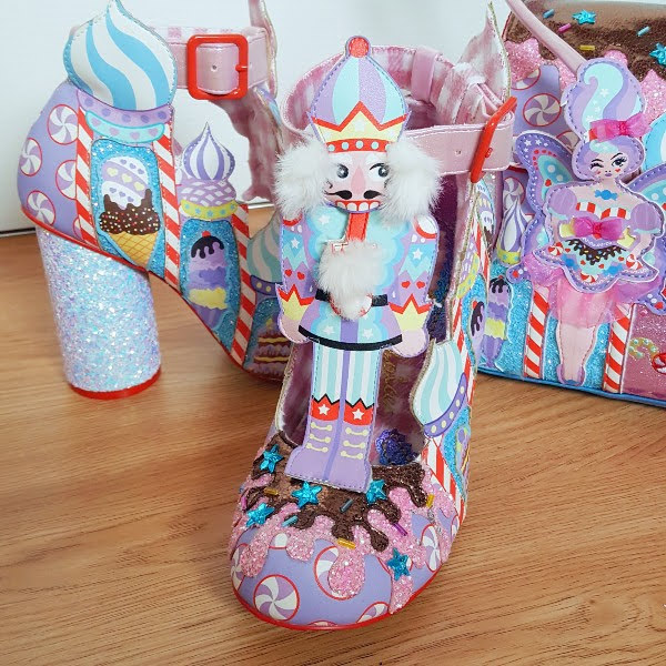 Nutcracker themed shoe with matching handbag in background