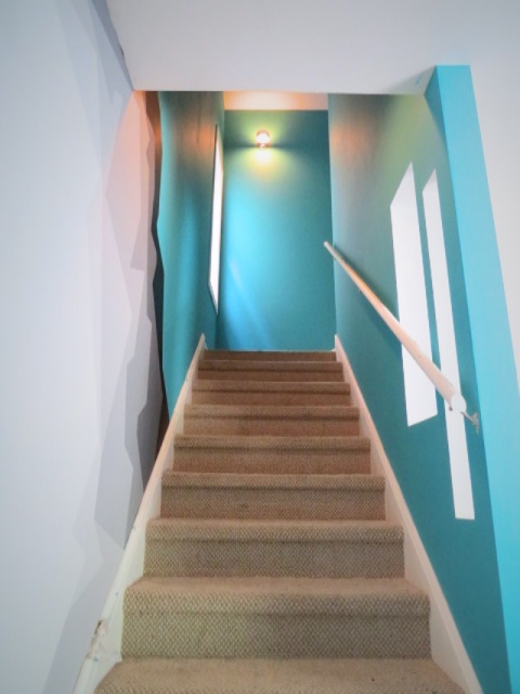 before paint and carpeted stairs
