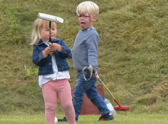 Mint Velvet Navy & Grey Stripe Zip Back Knit. Mia Tindall attends the Maserati Royal Charity Polo Trophy