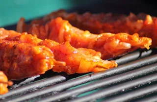 Suya typically costs around 200 naira or .63 cents US for a stick and can be made with grilled chicken, beef, fish bits of kidney, liver and gizzard, and sometimes goat meat