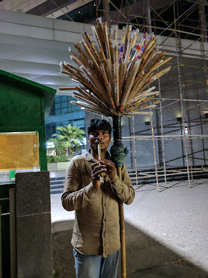 Flute seller who plays flute all day long standing