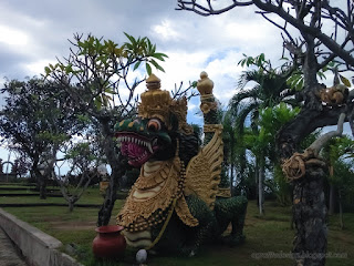 Dragon Statue Between Trees In The Garden Yard At Buddhist Monastery North Bali Indonesia