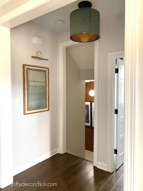 blue and white pinstripe wallpaper foyer