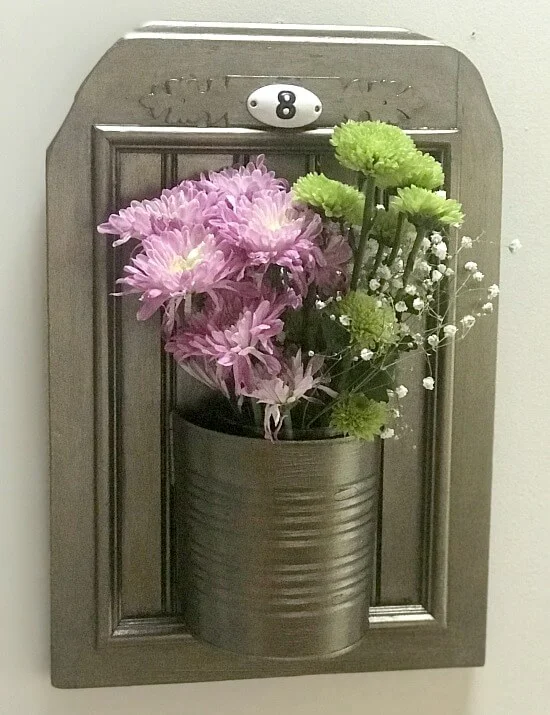 Fresh flowers in a recycled aluminum can planter