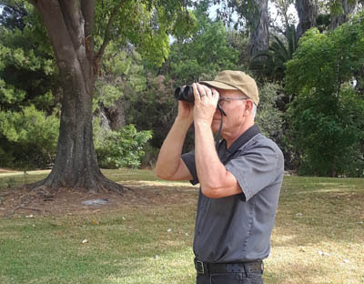 Photo of the author viewing birds with binoculars Photo of the author viewing birds with binoculars