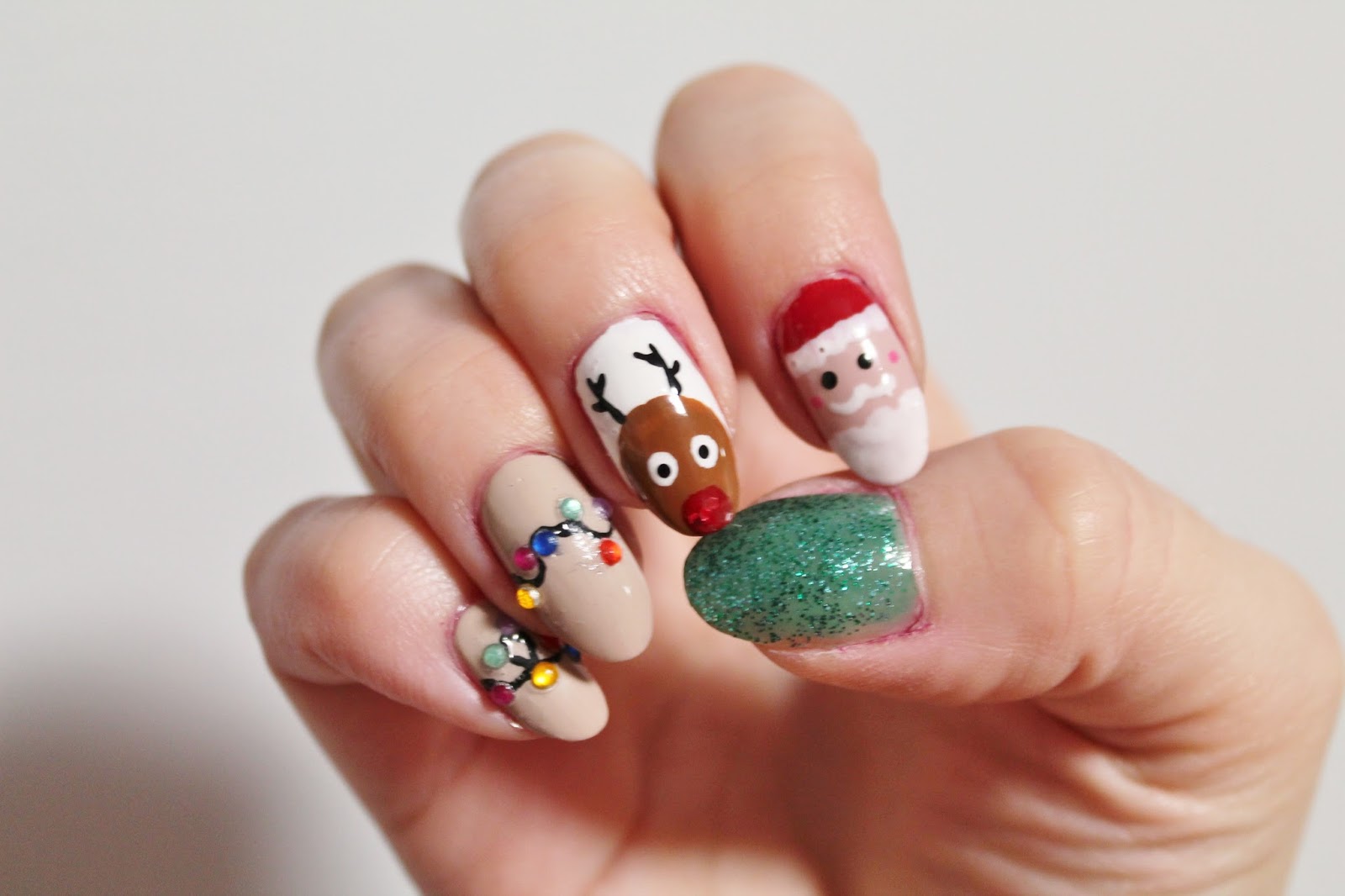 Christmas Nail Art with Santa, a reindeer, and some Christmas lights ...