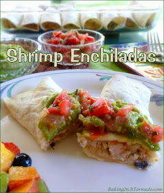 Shrimp Enchiladas feature large and small shrimp, spicy cheese and rice rolled into a soft tortilla and baked.  | Recipe developed by www.BakingInATornado.com | #recipe #dinner