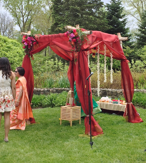 Mandap birch chuppah with deep gem tones floral corners and flower garlands for Ann Arbor wedding by Sweet Pea floral design 