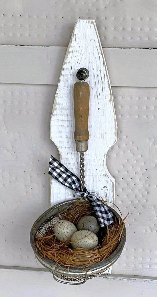 vintage strainer with eggs and bow