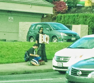 Accordion playing street musician in Kent, Washington.