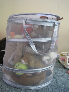 Stuffed toys in laundry basket