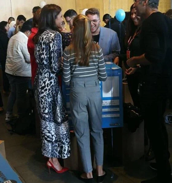 Queen Letizia wore a leopard-print silk blouse and midi skirt by Victoria Beckham. Crown Princess Leonor, Carolina Herrera