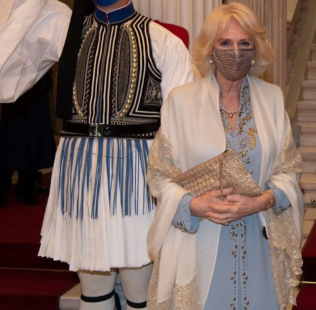 Prime Minister Kyriakos Mitsotakis and Katerina Sakellaropoulou. Camilla wore a tailored embellished maxi dress design by Anna Valentine