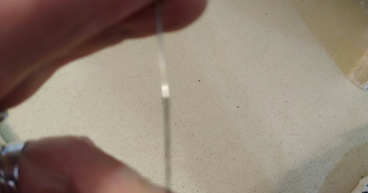 A Jewish Grandmother Threading a Needle, Quite a Challenge at My Age