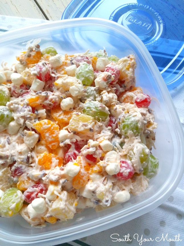 Ambrosia Fruit Salad! This retro fruit salad is simple and perfect with pineapple, mandarin oranges, cherries, green grapes, pecans, coconut and sour cream.