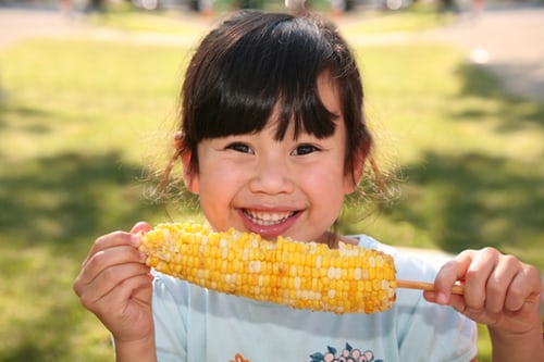corn eating baby