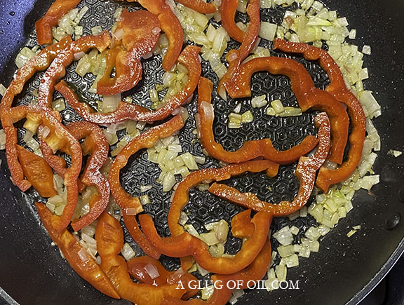 Frying onions and peppers Thai red curry