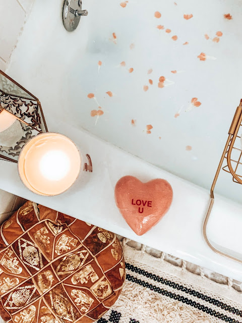 Bathtub with leather ottoman and bath caddy