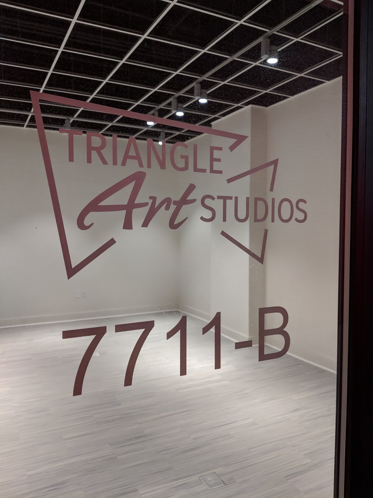 Robert Dyer Bethesda Row Triangle Art Studios signage appears at the