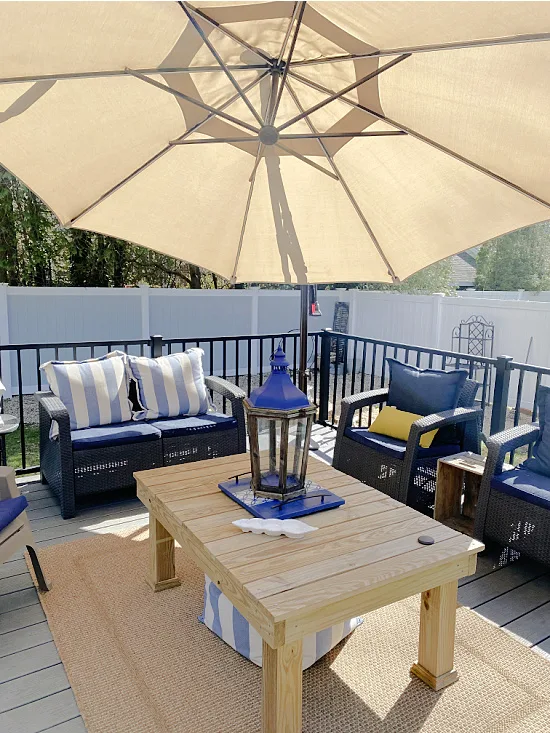 Outdoor seating area with large coffee table and tray