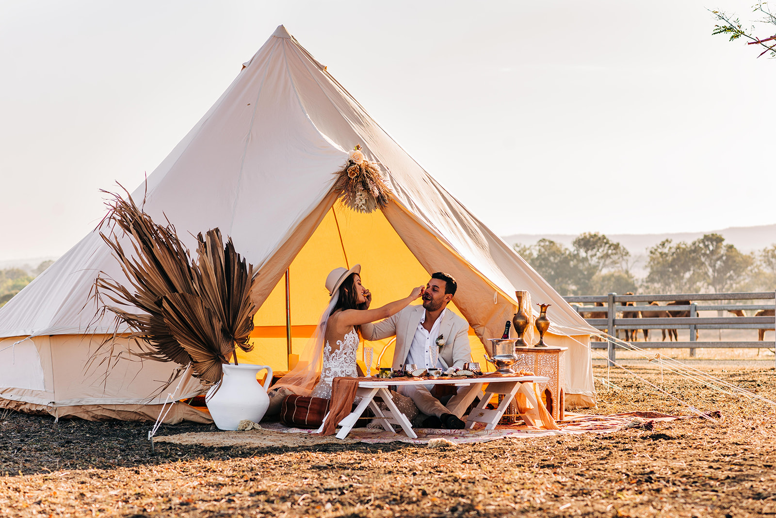 to the aisle australia | champagne at sunrise summer land camels shoot match made photography gold coast weddings country boho floral design cake stationery venue