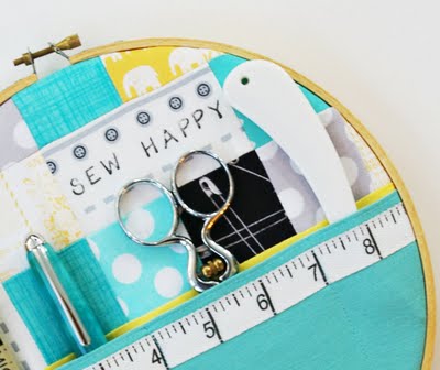 this sewing happy embroidery hoop art is a perfect way to store sewing supplies
