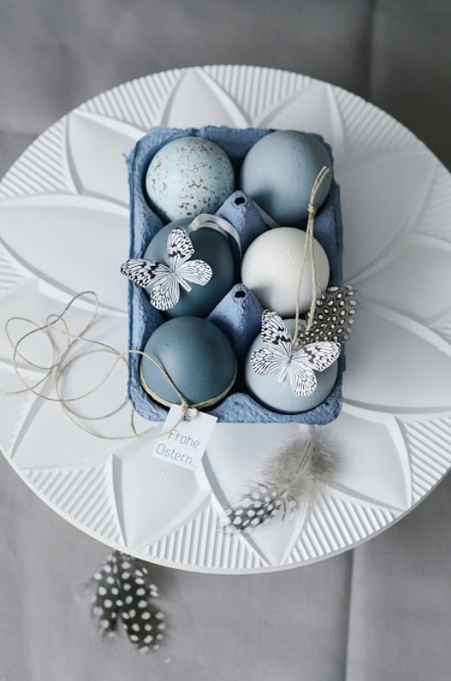romantic blue colors Easter eggs with paper butterflies