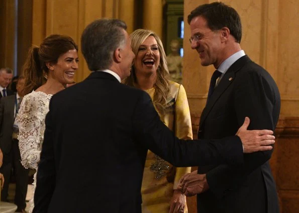 Queen Maxima wore Oscar De La Renta cold shoulder ruffled wool midi dress and Natan Embroidered yellow dress from Spring Summer 2018 collection