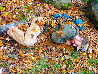 Hiker covered in leaves