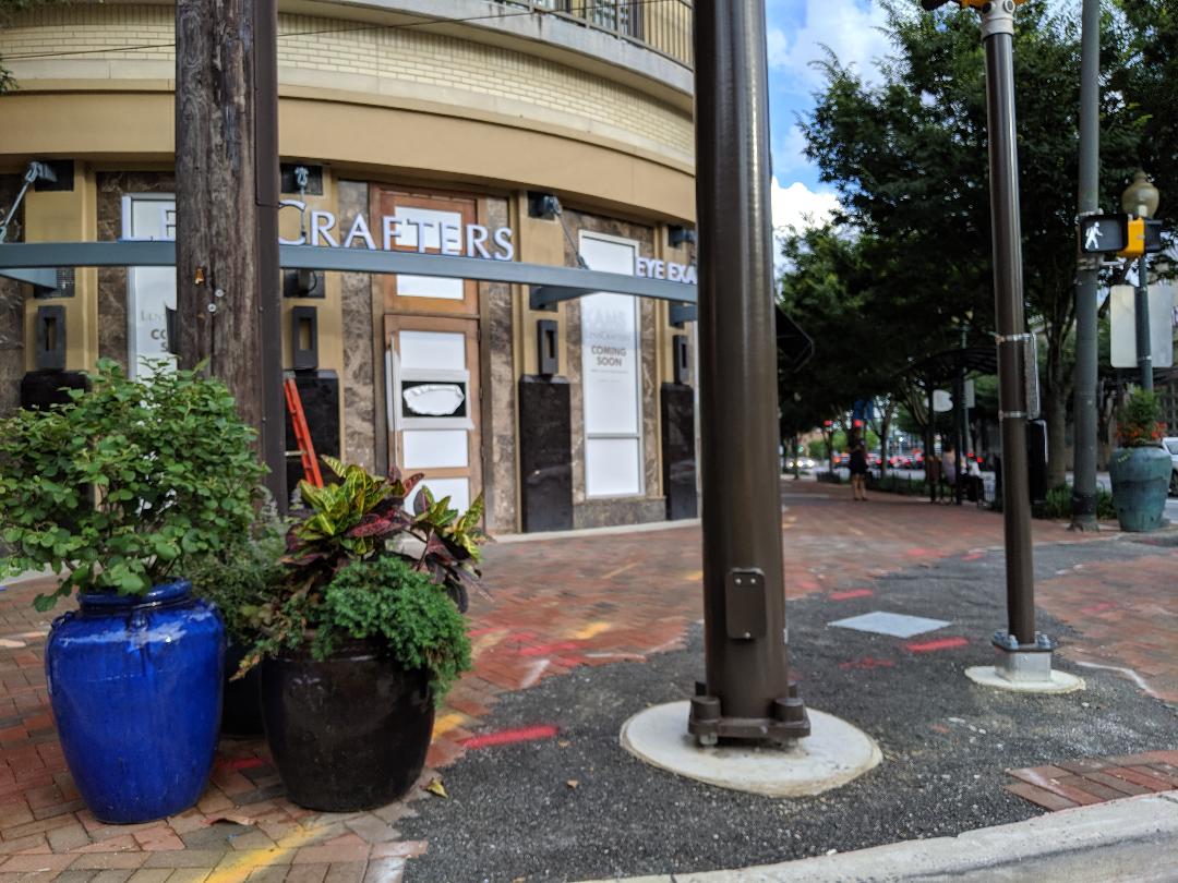 Robert Dyer Bethesda Row Sign installed at LensCrafters at Bethesda Row