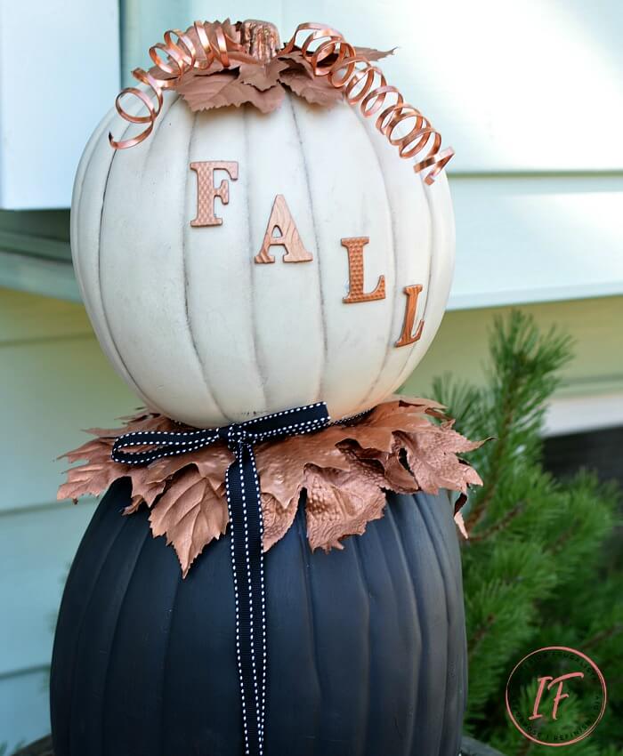 A non-traditional twist for making stacked pumpkin topiaries for fall with painted faux pumpkins and unique copper elements to flank your front door.